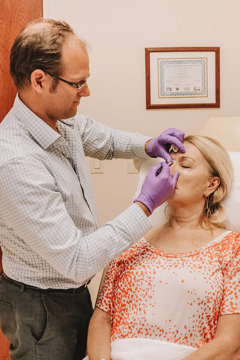 Female patient receiving fillers and collagen stimulators