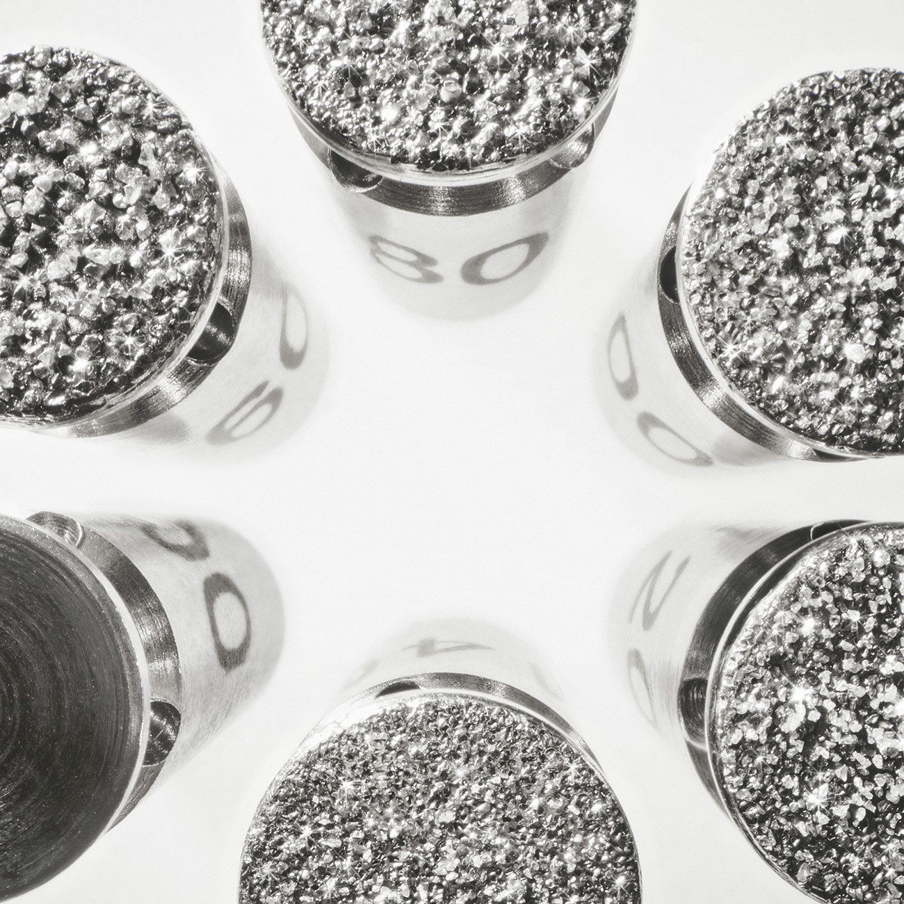 Close-up of sparkling diamond microdermabrasion tips, numbered 80.